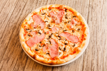 pizza on wooden background