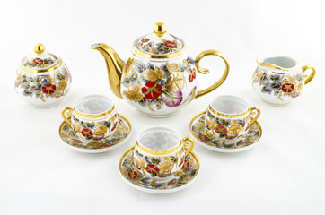 Obraz na płótnie Canvas Antique porcelain tea and coffee set with flower motif