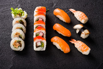 Sushi on black stone table