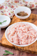 Fototapeta na wymiar Fresh raw chopped chicken meat in a bowl
