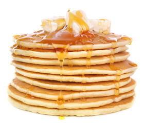 Stack of delicious pancakes with butter and honey isolated