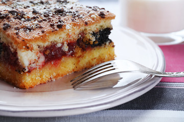 Homemade pie with jam and glass of milk