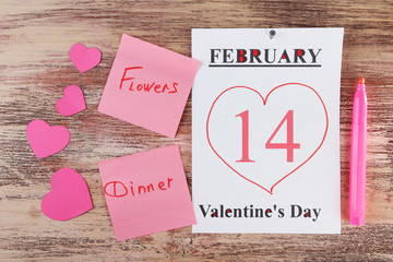 Valentines Day, February 14 on calendar on wooden background
