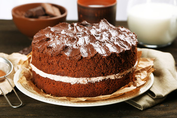 Delicious chocolate cake on table close-up