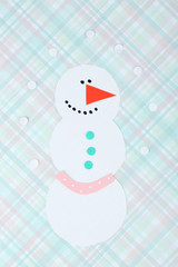 Handmade snowman on bright background