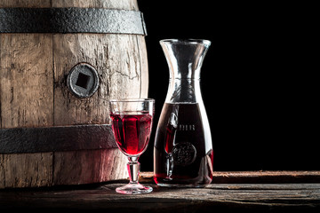 Glass of red wine in the rustic basement