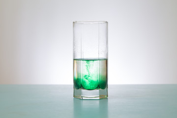 glass of green water