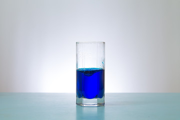 glass of blue liquid