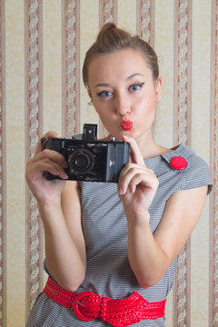young woman advertises old camera