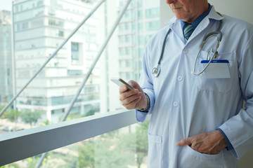 Doctor with smartphone