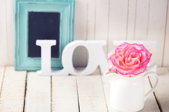 Postcard with elegant  flower and word love