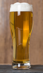 Glass beer on wood background
