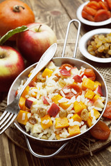 Sweet pilaf with pumpkin, apples and dried fruit
