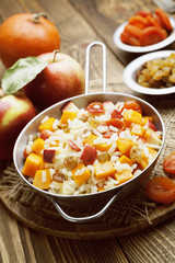 Sweet pilaf with pumpkin, apples and dried fruit