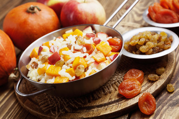 Sweet pilaf with pumpkin, apples and dried fruit