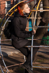 Pretty young girl walks on playground