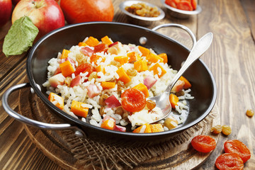 Sweet pilaf with pumpkin, apples and dried fruit