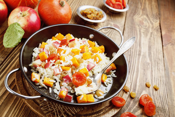 Sweet pilaf with pumpkin, apples and dried fruit