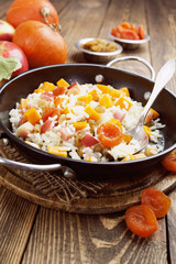 Sweet pilaf with pumpkin, apples and dried fruit
