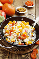 Sweet pilaf with pumpkin, apples and dried fruit