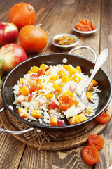 Sweet pilaf with pumpkin, apples and dried fruit