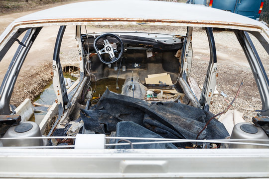 disassembled car at an automobile junkyard