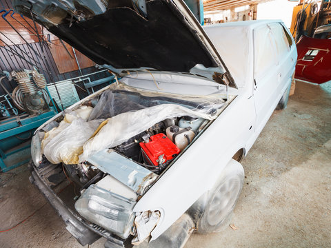 repairing of old car in country garage
