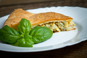 Freshly baked traditional Russian homemade pie with potatoes and