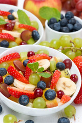 Fototapeta na wymiar delicious fruit and berry salad in a bowl