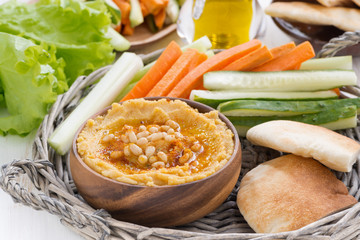 hummus with pita bread and vegetables