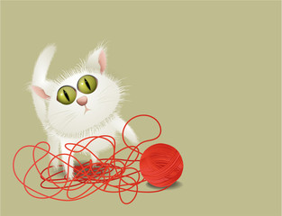 Little cat playing with ball of wool