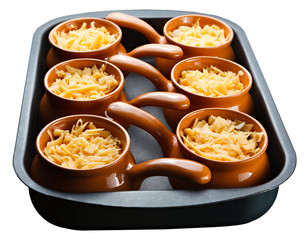 Roast with vegetables, meat and cheese in pottery. isolation