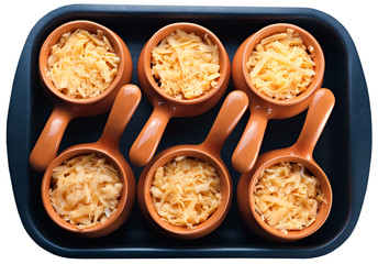 Roast with vegetables, meat and cheese in pottery. isolation