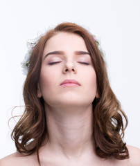 Portrait of a beautiful young woman with closed eyes