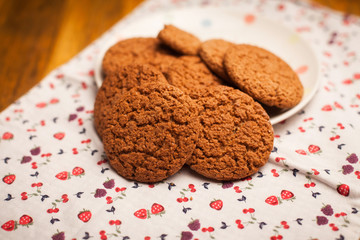Oatmeal cookies on napkin on table