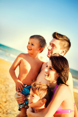 happy family having fun in the sea travel