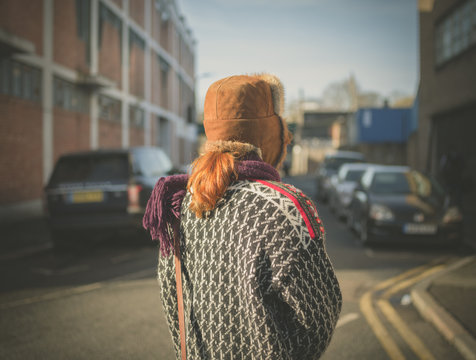 Woman walking in a city in the winter