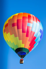 single colorful hot air balloon in flight