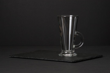 Empty Glass on Slate Stone Mat