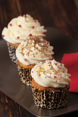 Cupcakes With Cream And Sprinkles