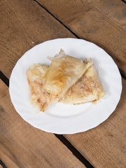Pieces of cheese pie on plate