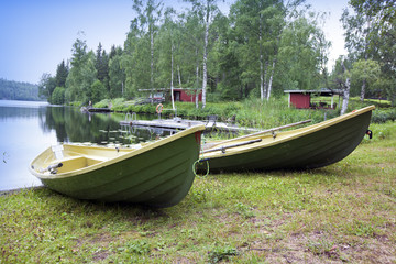 Boats on the bank of the forest lake