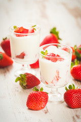 Fluffy and full of vitamins healthy strawberries on white wooden