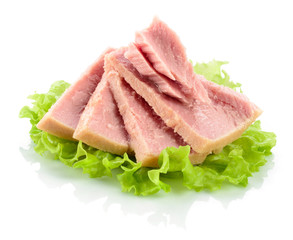 Tuna. Canned fish on green lettuce leaf