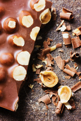 milk chocolate bar with nuts, selective focus