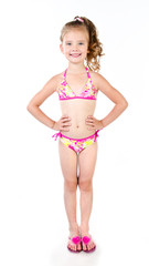 Obraz premium Cute smiling little girl in swimsuit isolated