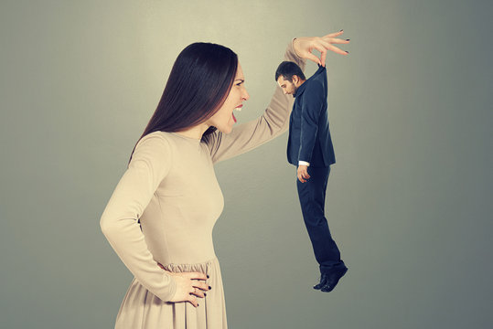 screaming woman looking at small man