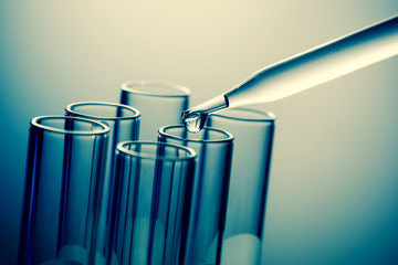 dropping liquid to test tubes