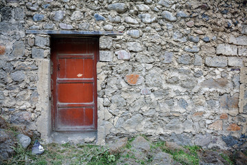 Old door in stone wall