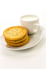Fototapeta na wymiar plain sugar cookies and cup of milk